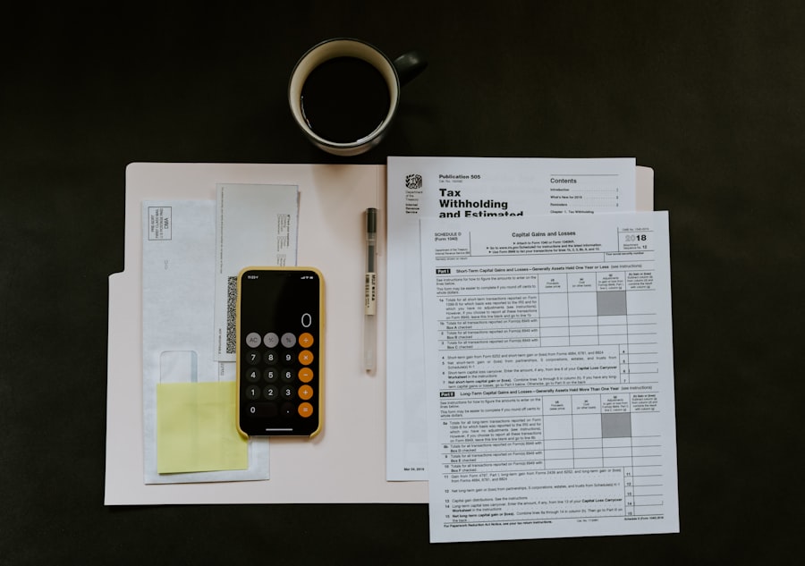 Policy paperwork, a calculator and coffee on a dark desk