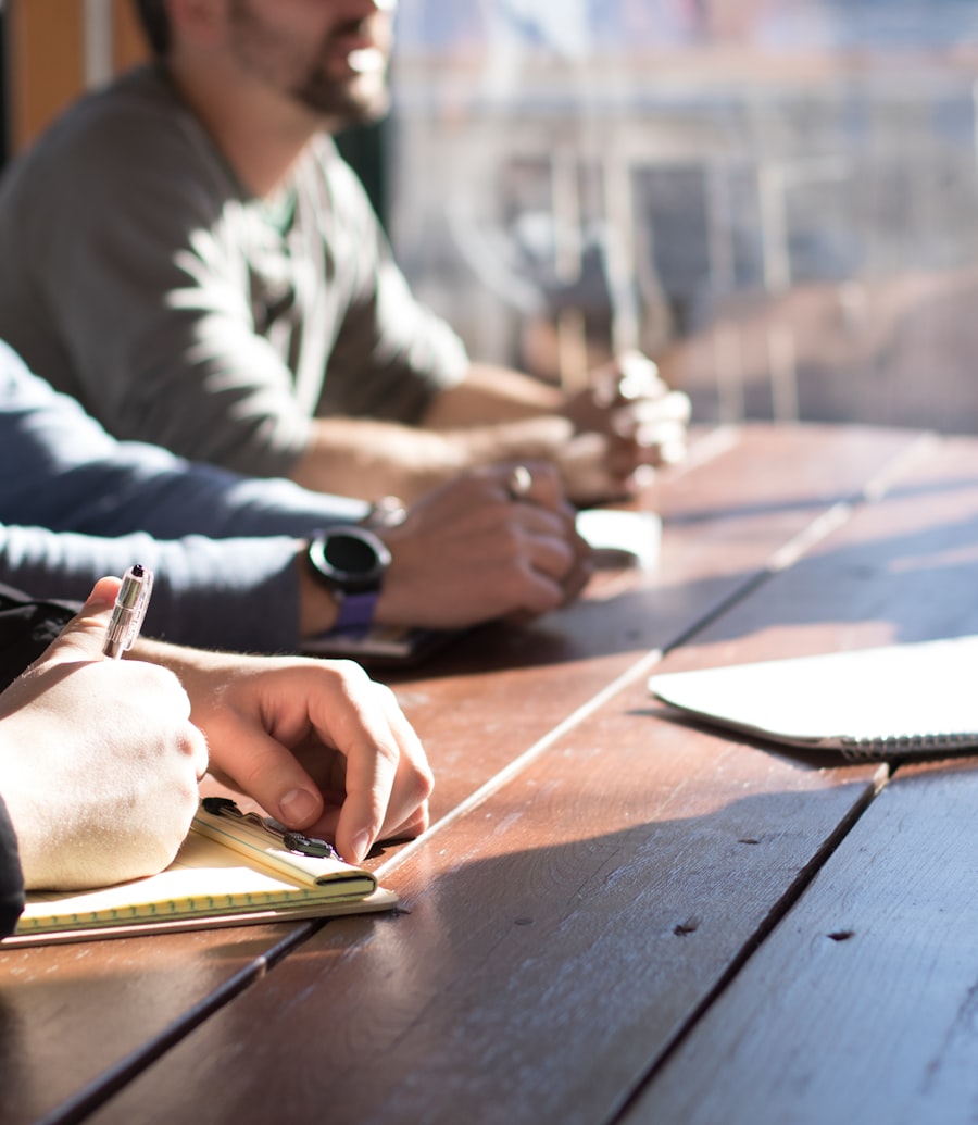 Colleagues reviewing plans together at a meeting table